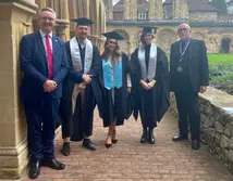 College principal and apprentices outside Cathedral